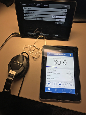 Figure 3b. Calibration with NIOSH SLM app, showing microphone underneath headphones